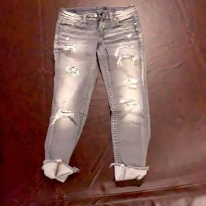 Grey distressed ankle skinny